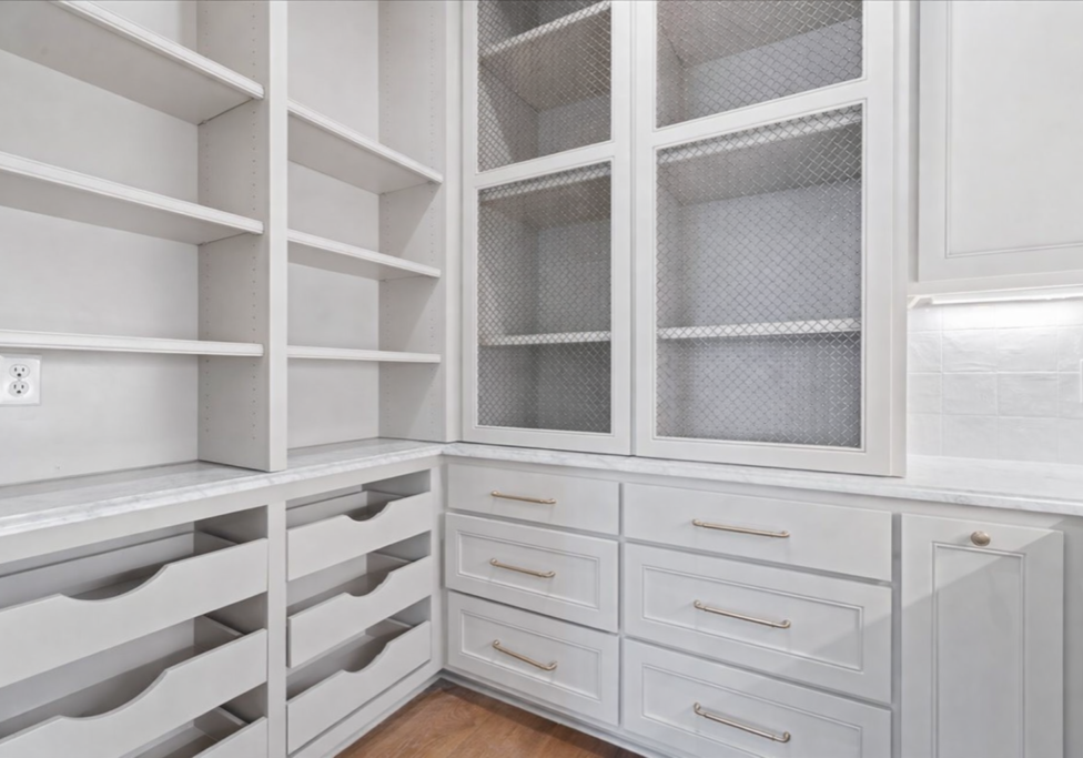 Modern kitchen pantry with marble countertop
